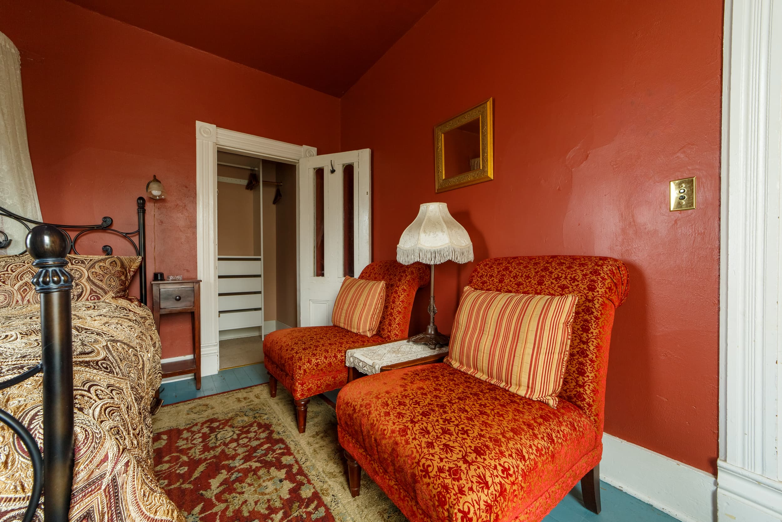 Closet with plenty of hangign space and drawers.