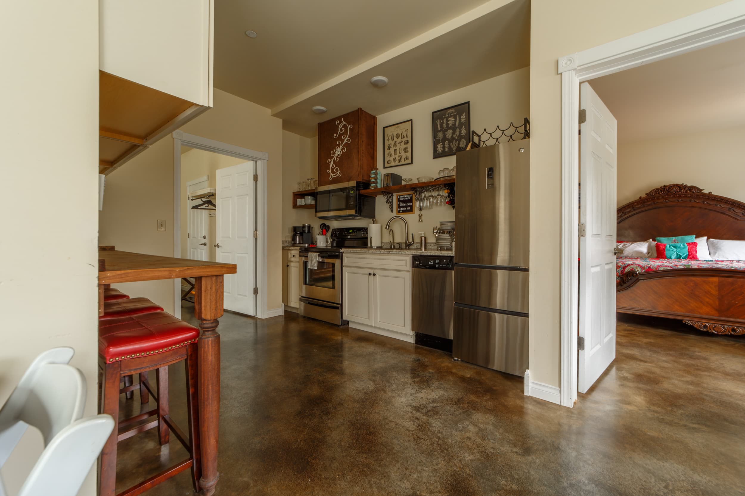 View from lounge showing kitchen and larger bedroom.