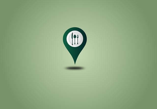 Green location marker featuring utensils icon on a light green background.